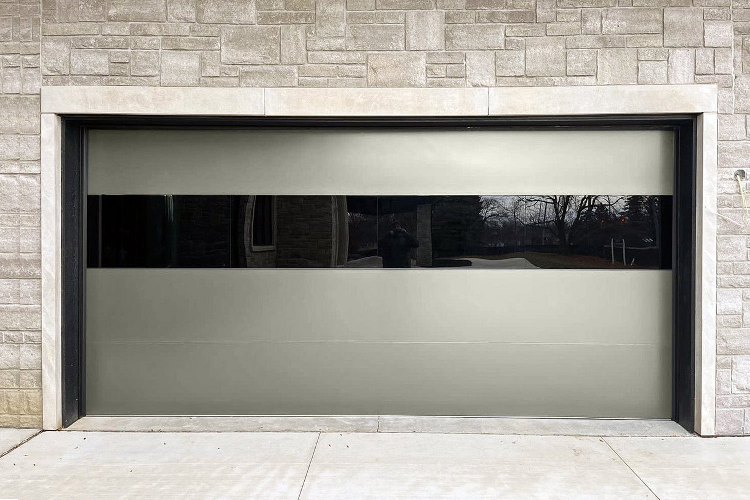 CHI Contemporary Sterling Insulated Modern Garage Doors with 2 row glass in Sandstone