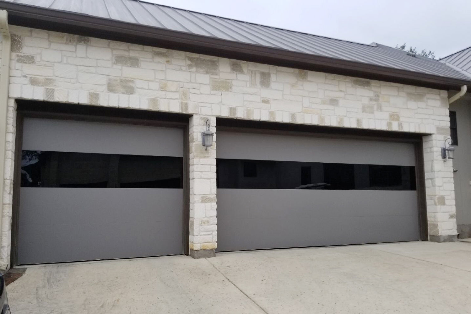 CHI Contemporary Sterling Insulated Modern Garage Doors with 2 row glass in Slate Gray