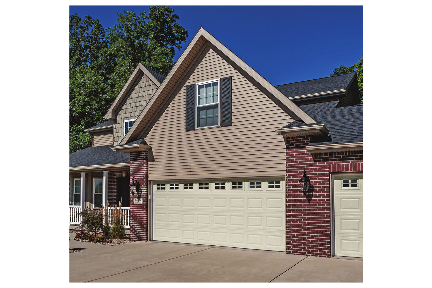 CHI Timeless Raised Panel Insulated Modern Garage Doors with Glass in Almond