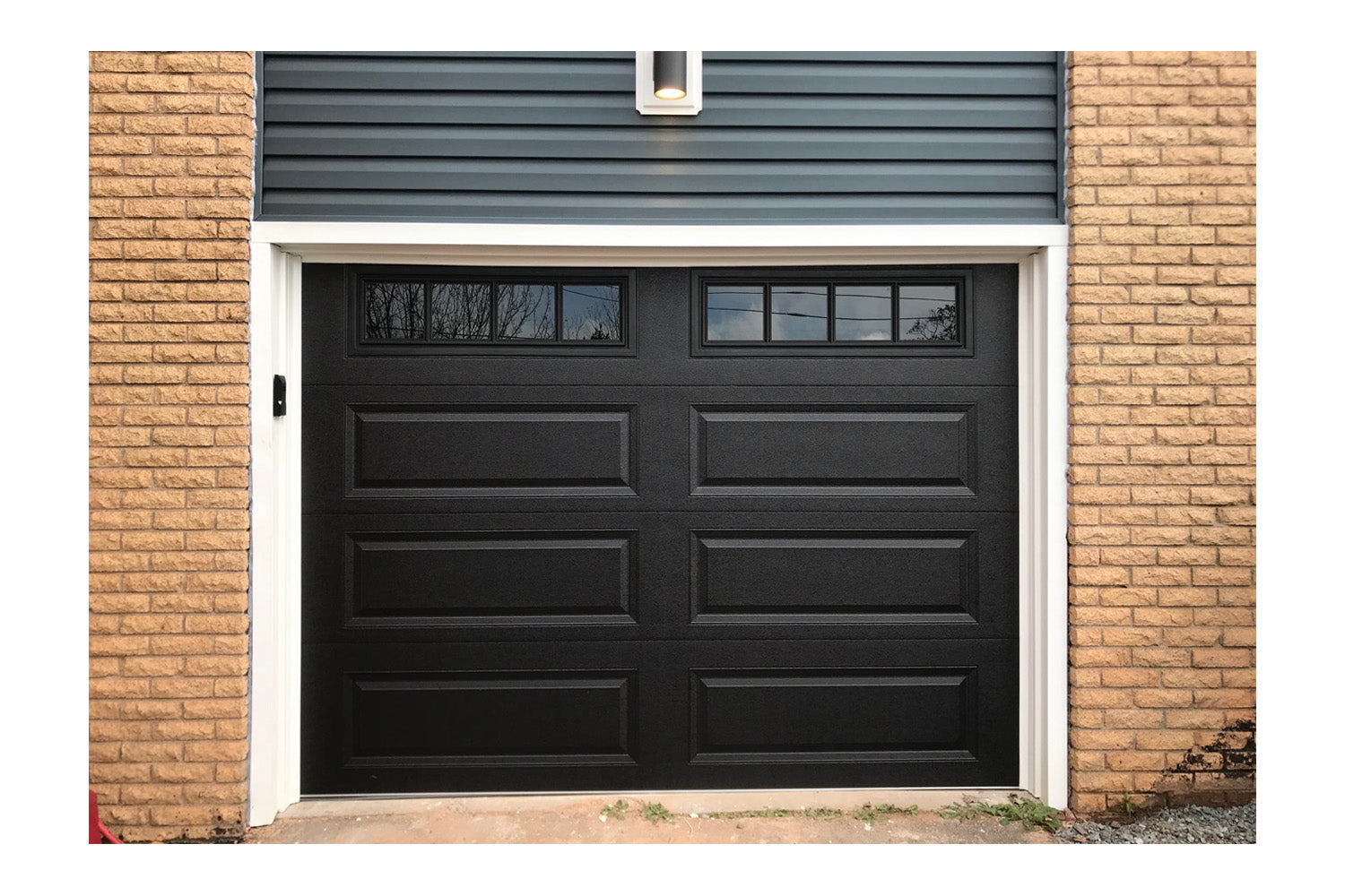 CHI Timeless Raised Panel Insulated Modern Garage Doors with Glass in Black