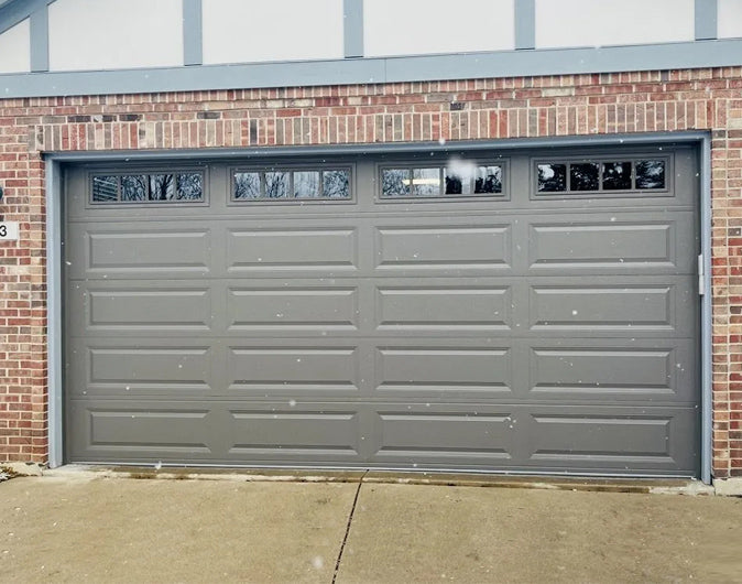 CHI Timeless Raised Panel Insulated Modern Garage Doors with Glass in Bronze