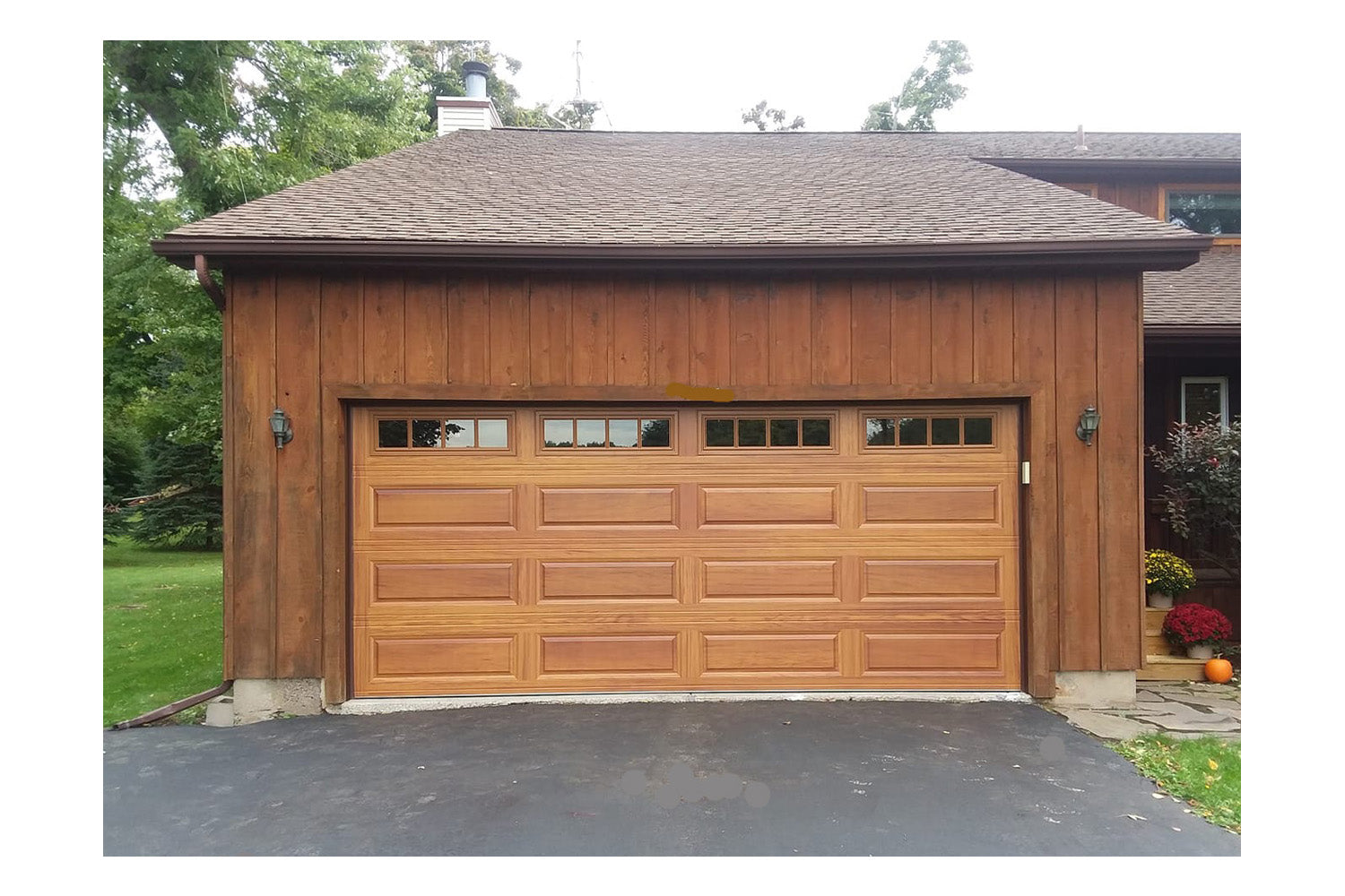 CHI Timeless Raised Panel Insulated Modern Garage Doors with Glass in Woodtone Cedar