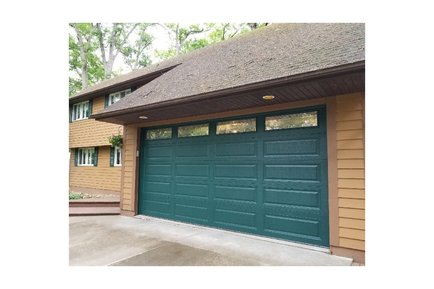 CHI Timeless Raised Panel Insulated Modern Garage Doors with Glass in Powder Coated Evergreen