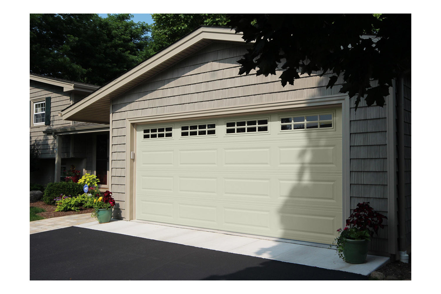 CHI Timeless Raised Panel Insulated Modern Garage Doors with Glass in Powder Coated Ivory
