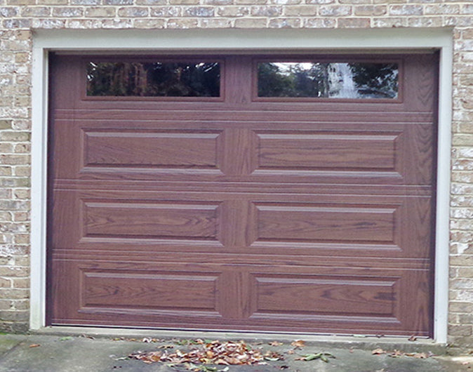 CHI Timeless Raised Panel Insulated Modern Garage Doors with Glass in Woodtone Mahogany