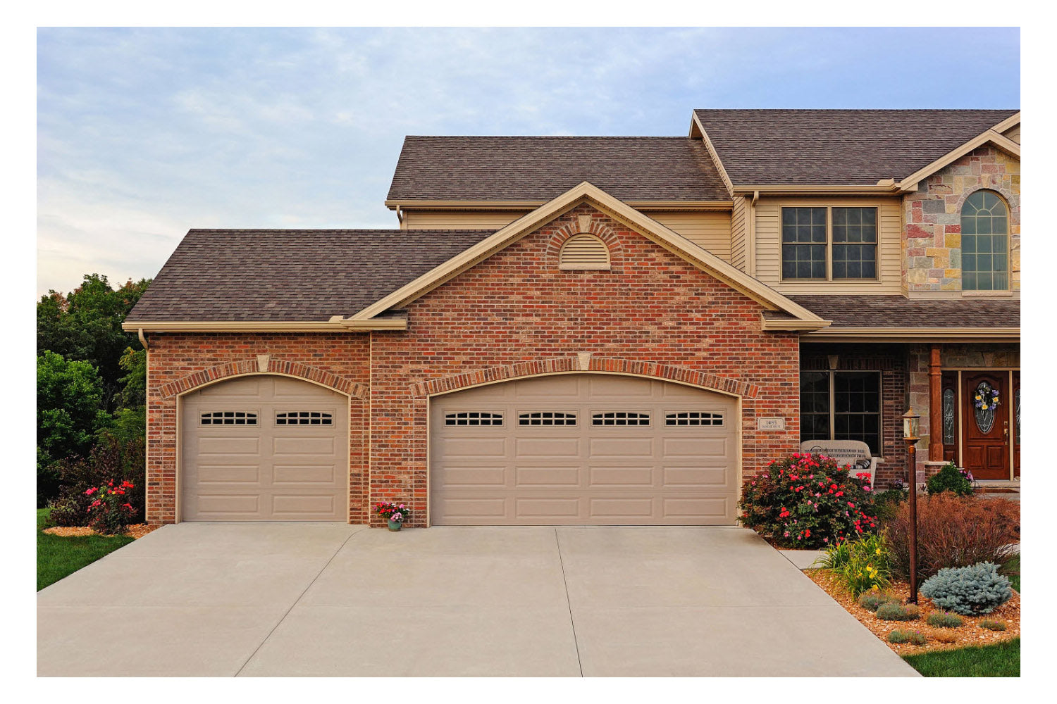 CHI Timeless Raised Panel Insulated Modern Garage Doors with Glass in Sandstone