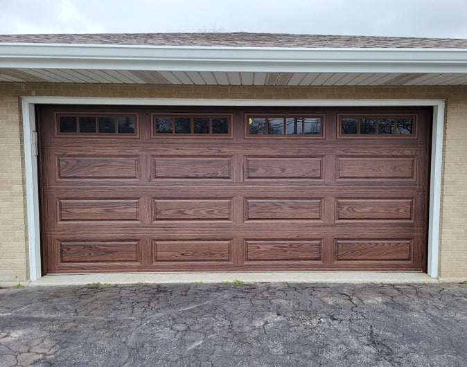 CHI Timeless Raised Panel Insulated Modern Garage Doors with Glass in Woodtone Walnut