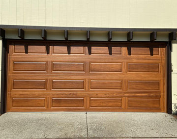 CHI Timeless Raised Panel Insulated Modern Garage Doors in Woodtone Cedar