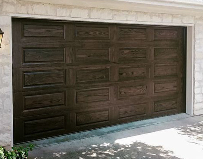 CHI Timeless Raised Panel Insulated Modern Garage Doors in Woodtone Dark Oak