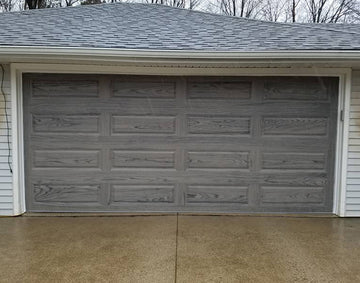 CHI Timeless Raised Panel Insulated Modern Garage Doors in Woodtone Driftwood