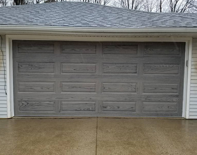 CHI Timeless Raised Panel Insulated Modern Garage Doors in Woodtone Driftwood