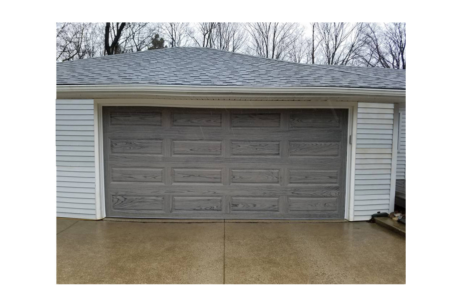 CHI Timeless Raised Panel Insulated Modern Garage Doors in Woodtone Driftwood