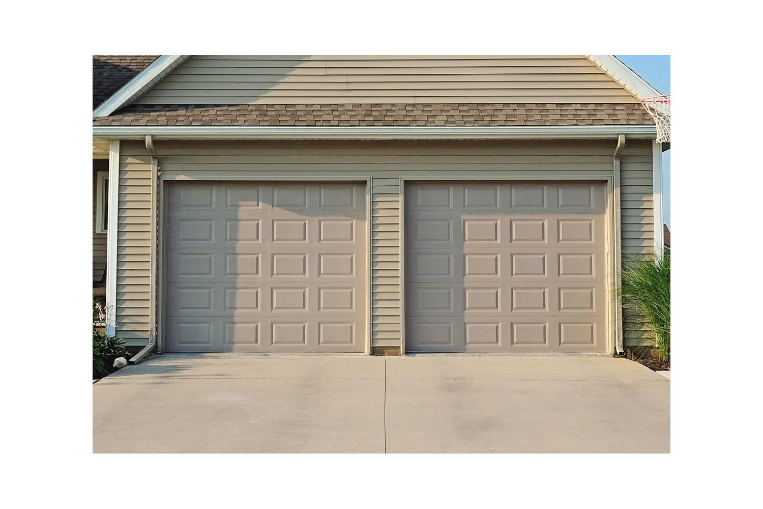 CHI Timeless Raised Panel Insulated Modern Garage Doors in Sandstone