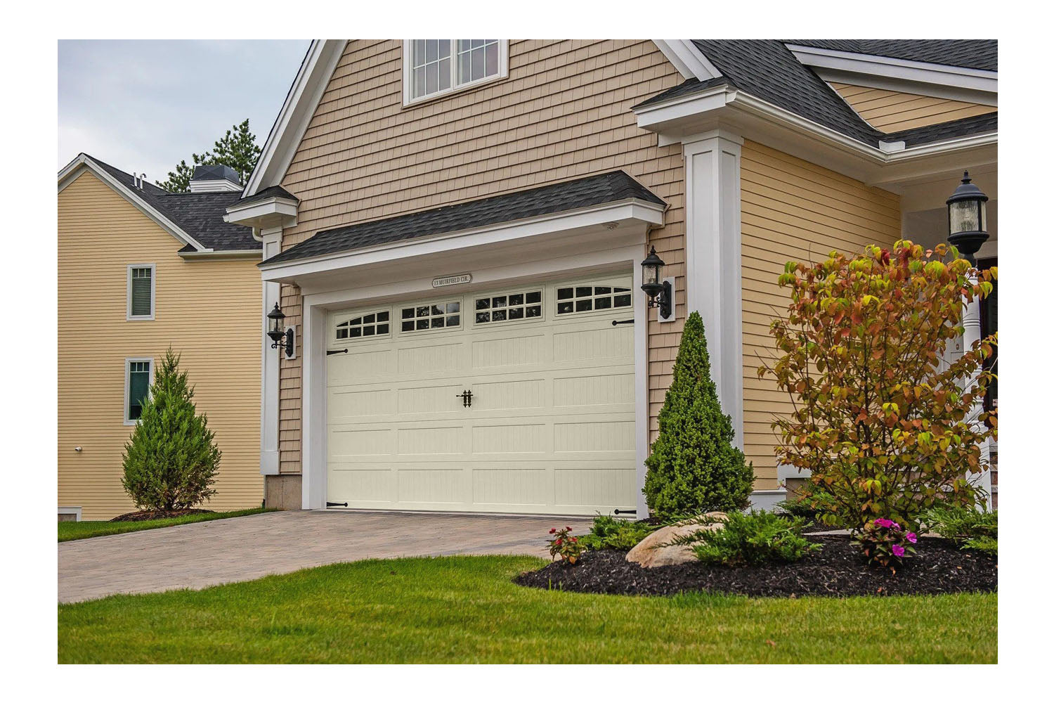 CHI Timeless Stamped Carriage House Insulated Modern Garage Doors with Glass in Almond