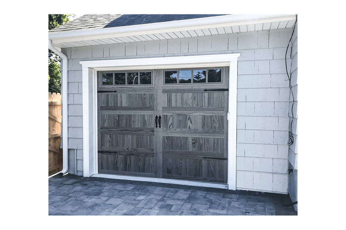 CHI Timeless Stamped Carriage House Insulated Modern Garage Doors with Glass in Woodtone Carbon Oak