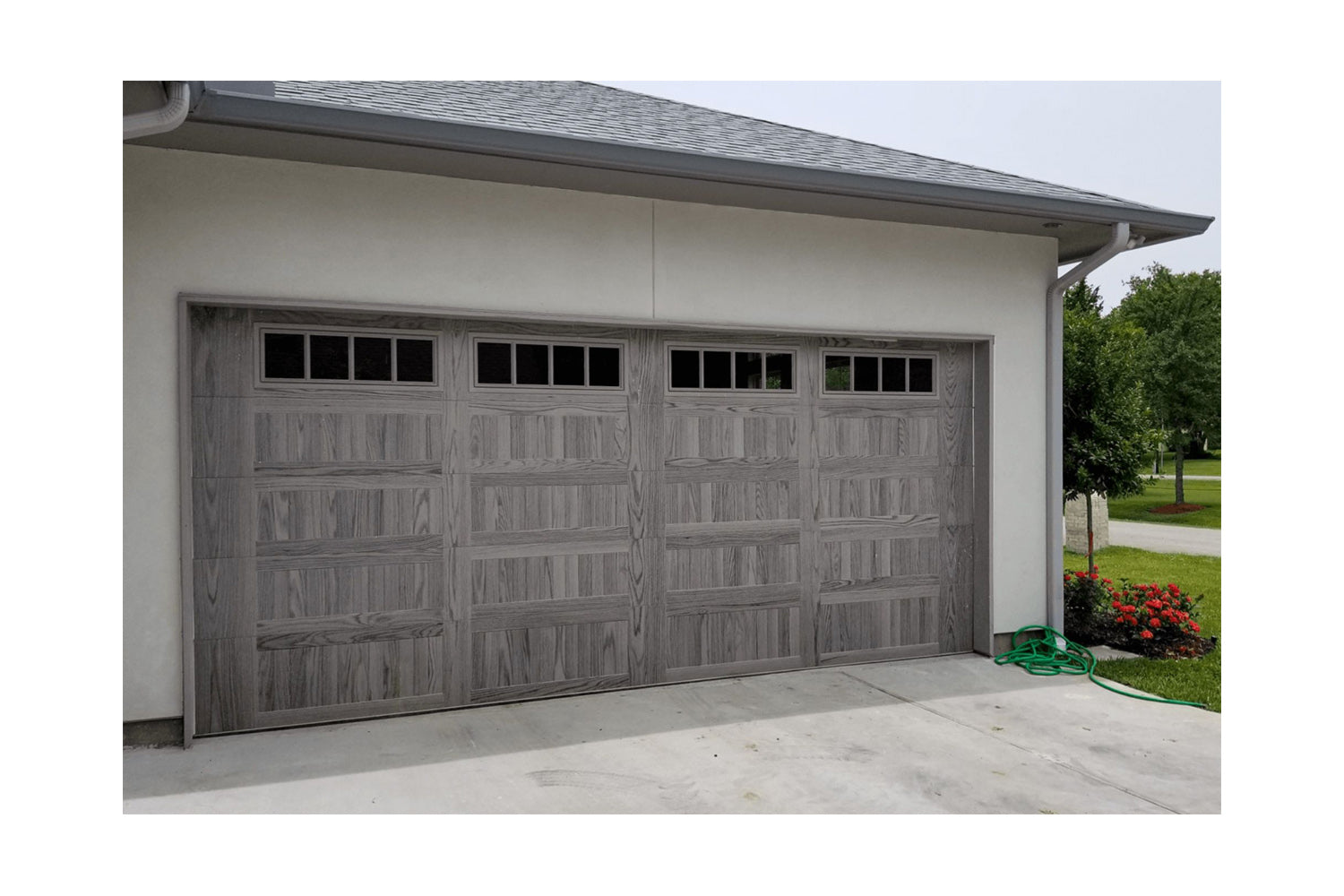 CHI Timeless Stamped Carriage House Insulated Modern Garage Doors with Glass in Woodtone Driftwood