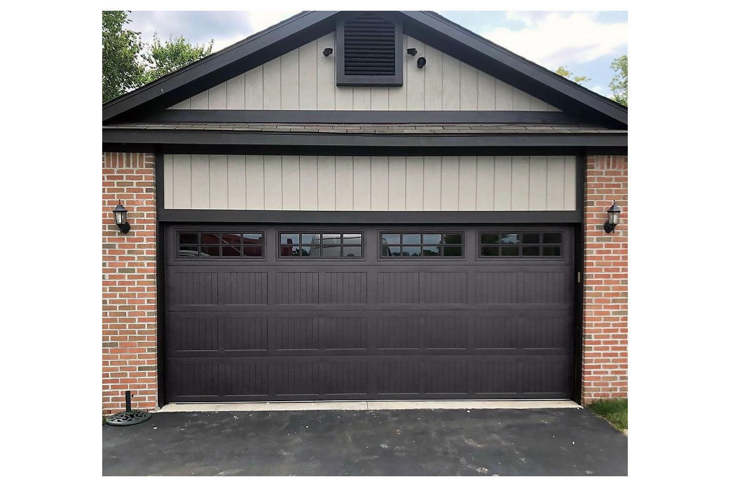 CHI Timeless Stamped Carriage House Insulated Modern Garage Doors with Glass in Powder Coated Solar Black