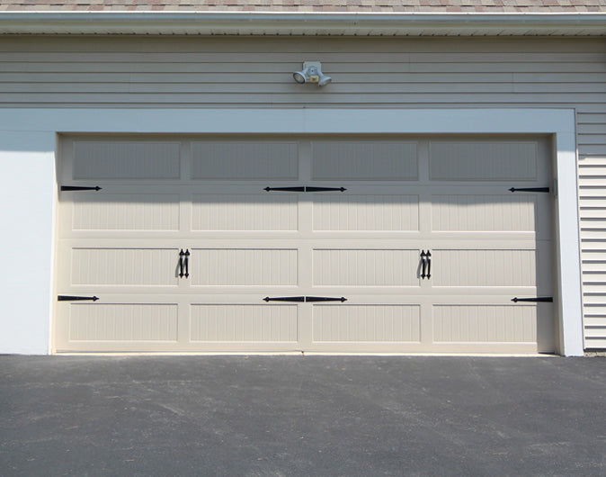 CHI Timeless Stamped Carriage House Insulated Modern Garage Doors in Almond