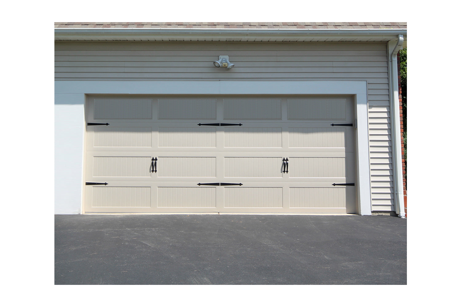 CHI Timeless Stamped Carriage House Insulated Modern Garage Doors in Almond