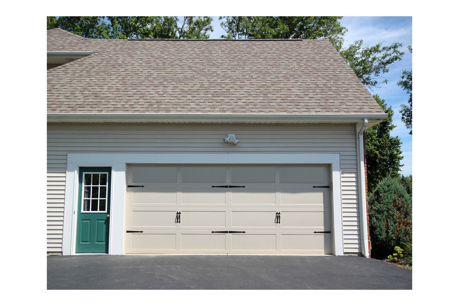 CHI Timeless Stamped Carriage House Insulated Modern Garage Doors in Almond