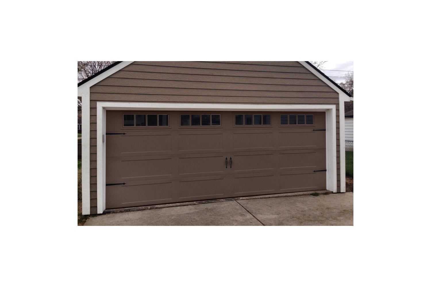 CHI Timeless Stamped Carriage House Insulated Modern Garage Doors in Brown
