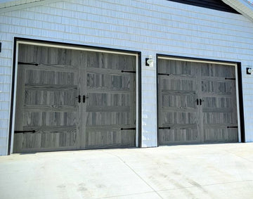 CHI Timeless Stamped Carriage House Insulated Modern Garage Doors in Woodtone Carbon Oak