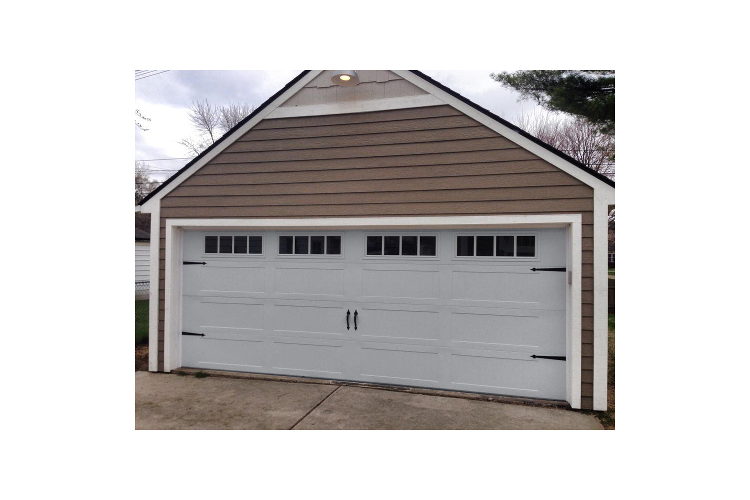CHI Timeless Stamped Carriage House Insulated Modern Garage Doors in Gray